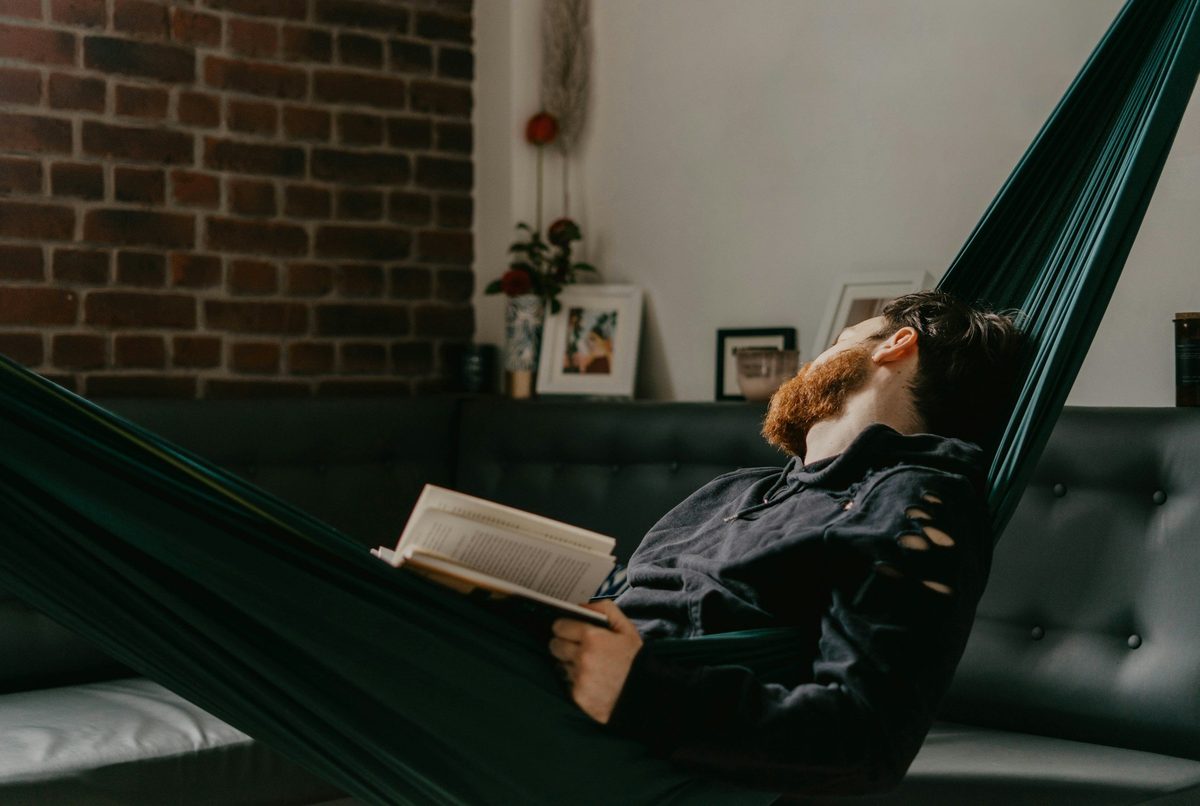 Relaxed car buyer enjoying free time at home instead of visiting dealerships